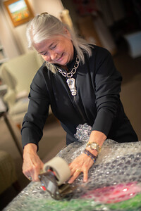 Nancy Junkin painting in a collector's home